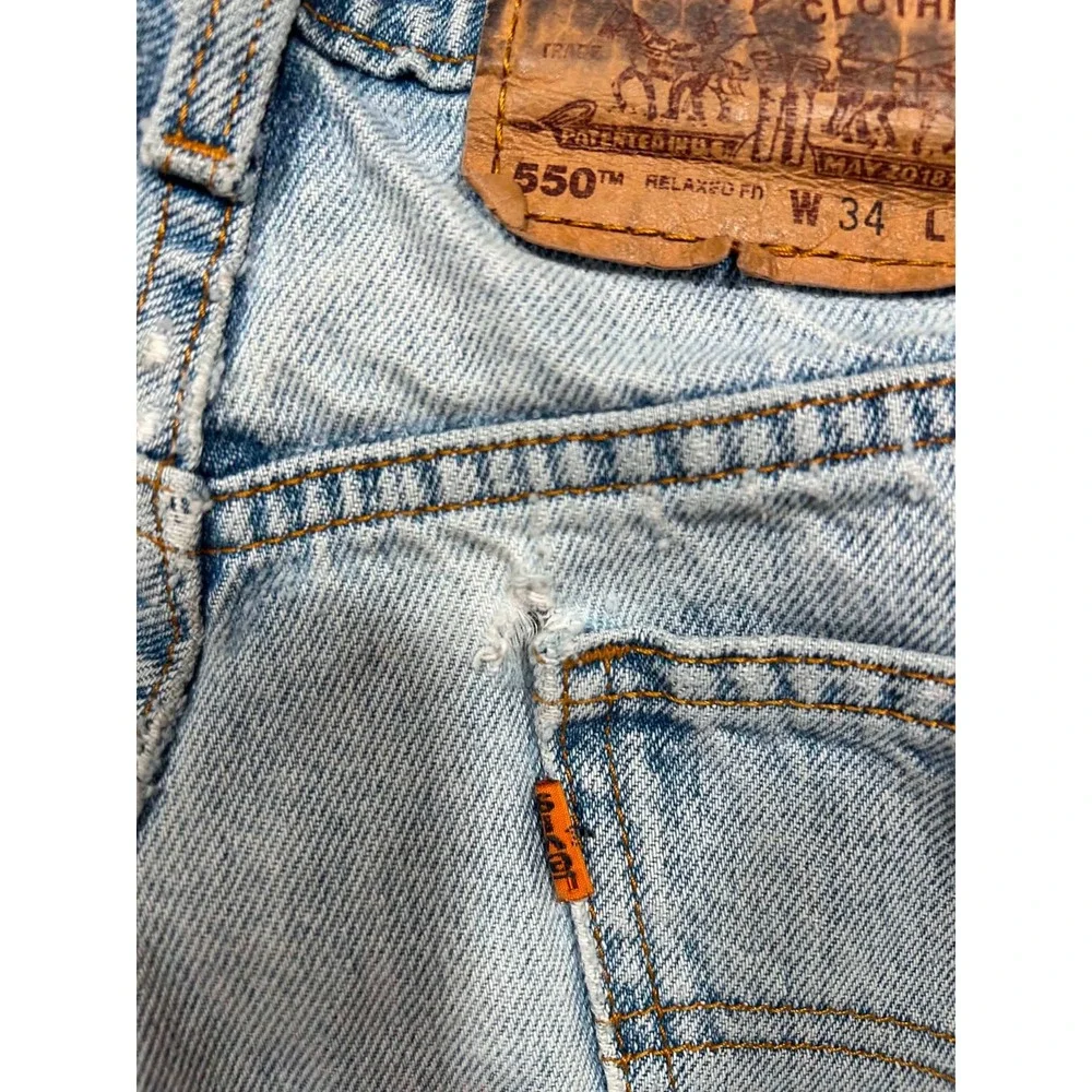 Vintage Levis 550 Orange Tab Relaxed Fit Light Wash Distressed Jeans W34 L32